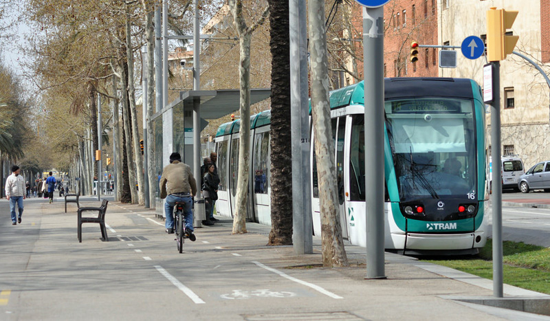 Cyclist and tramway crossing paths